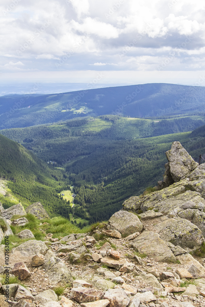 Background beautiful layered mountain landscape with hills and rocks view from the top of Snezka mountain, Czech Republic