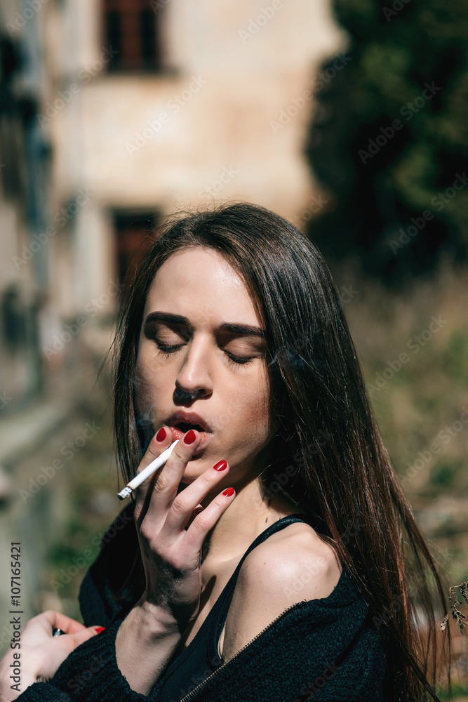 Portrait sexy brutal hipster girl with cigarette. Smoking girl woman