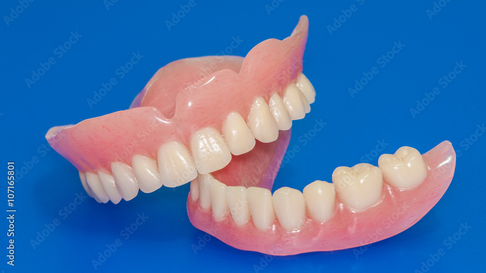 Fototapeta premium Dentures on a blue background