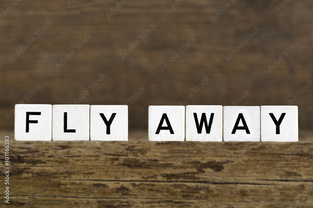 Naklejka premium The words fly away written in cubes