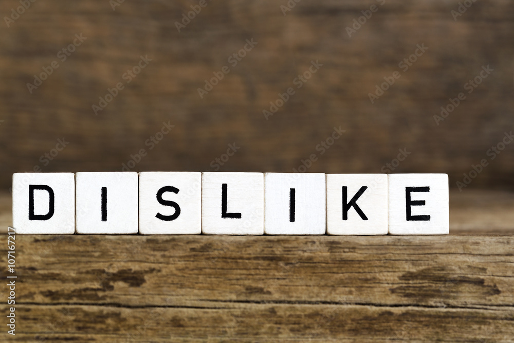 Fototapeta premium The word dislike written in cubes