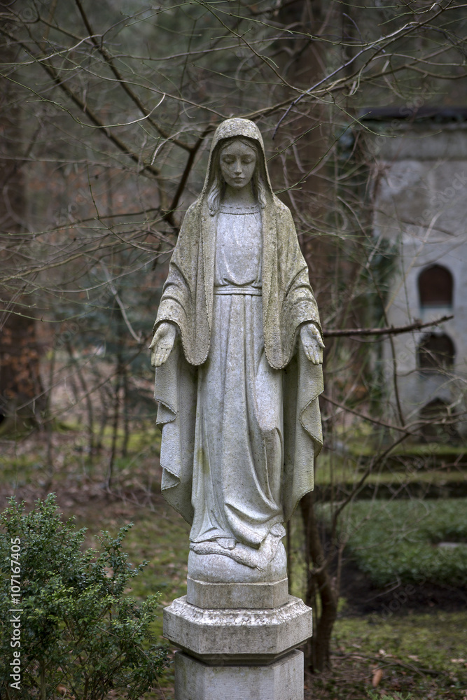 Overgrown grave stone