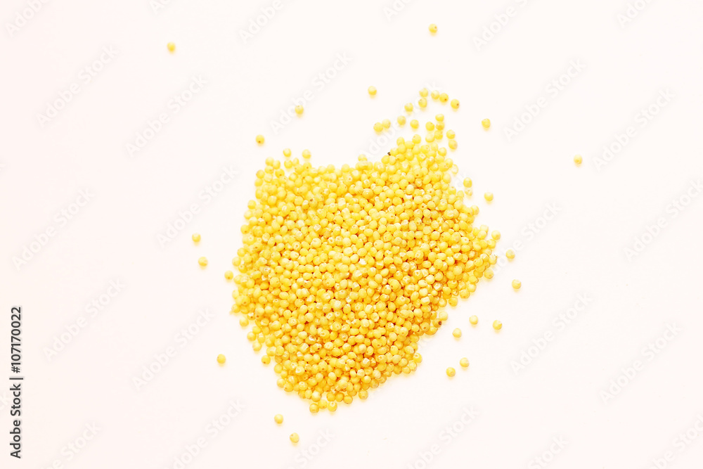 Heap of millet groats on white Heap of millet groats on white