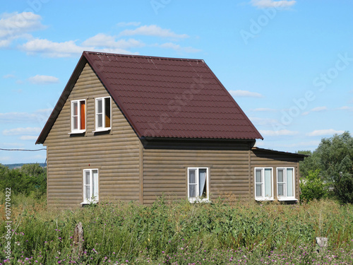 Wallpaper Mural Modern two-storeyed summer cottage against a blue sky Torontodigital.ca