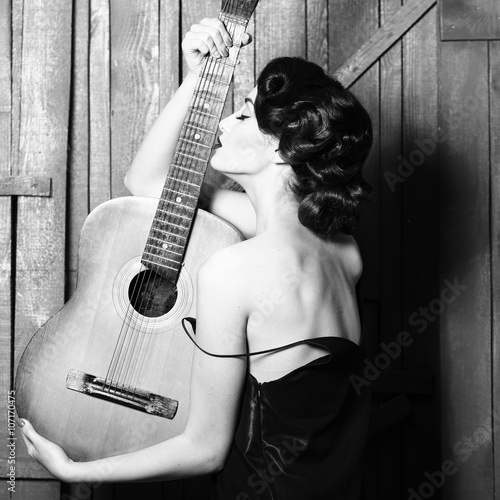 Retro woman with guitar photo