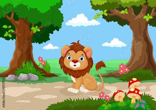 Funny baby lion sitting with a background of a beautiful garden