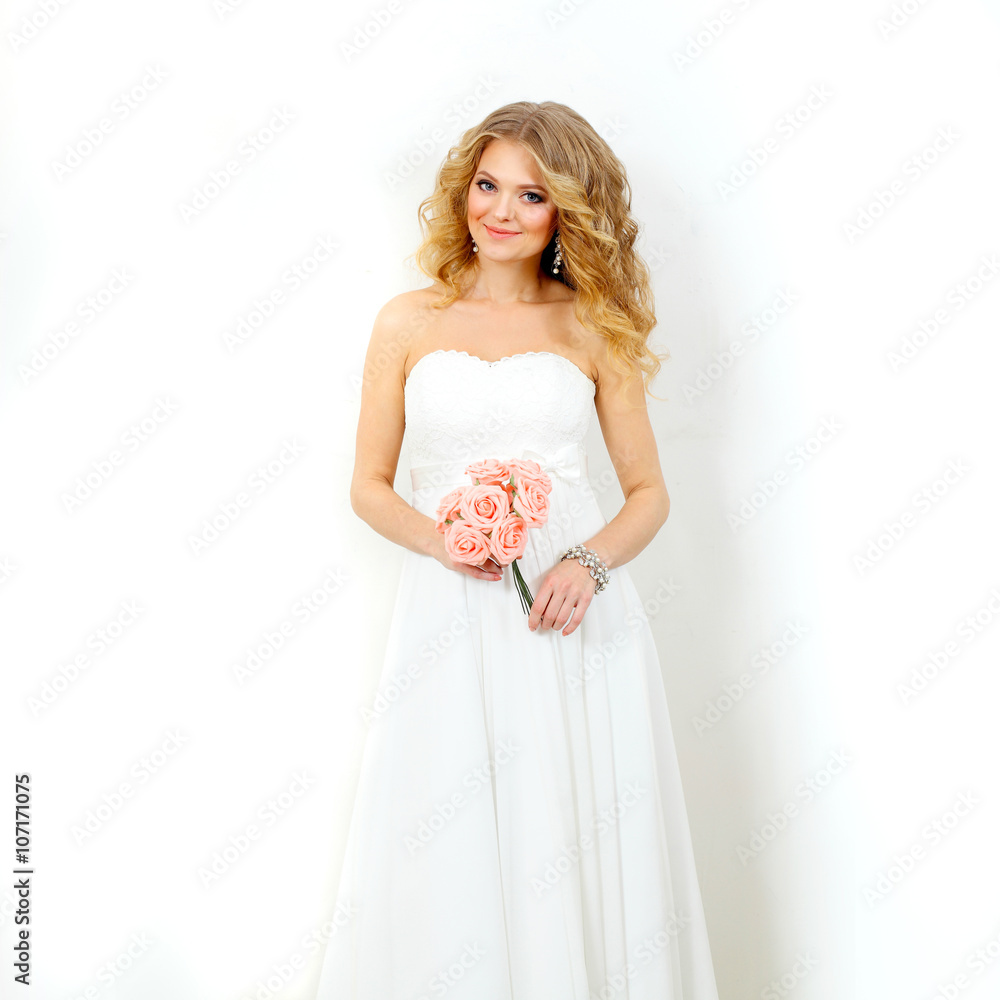 Portrait of the beautiful bride. beautiful blond bride on a white background. Wedding image. Portrait of the beautiful bride. beautiful blond bride on a white background. Wedding image.