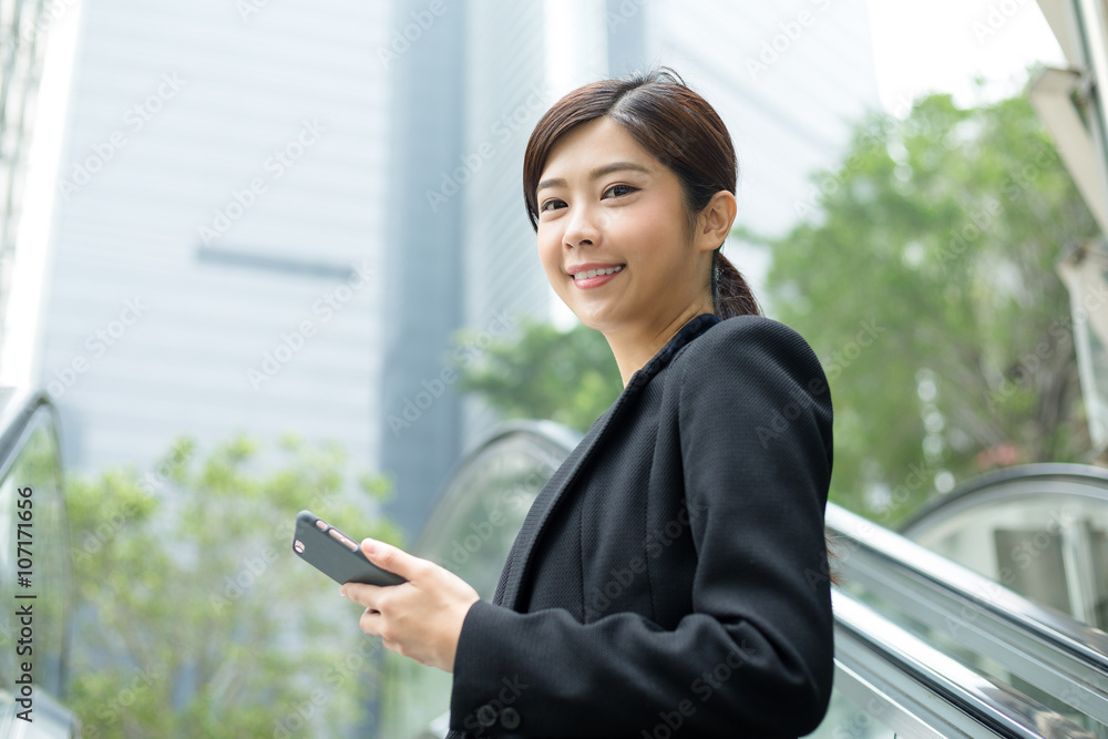 Businesswoman hold with cellphone at outdoor Businesswoman hold with cellphone at outdoor