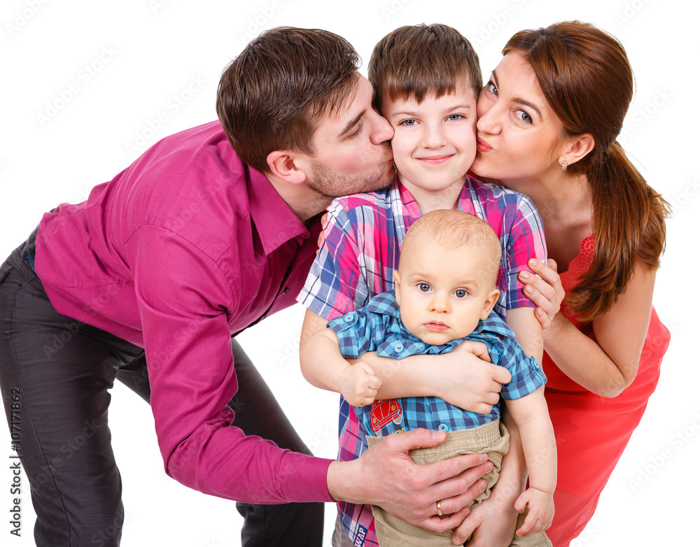 Happy four-member family. Isolated on White Background. Father and Mother with two boys. Parents with Children have fun Happy four-member family. Isolated on White Background. Father and Mother with two boys. Parents with Children have fun