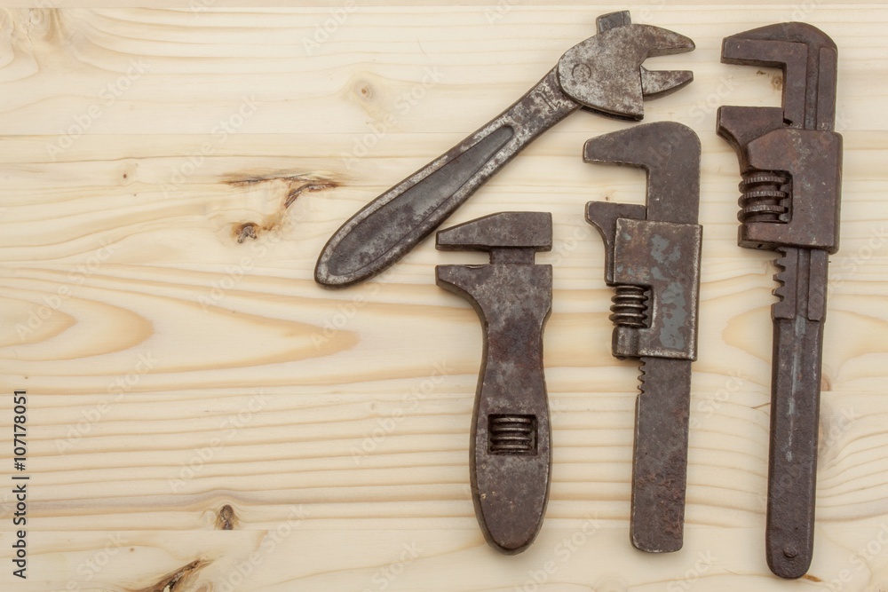Old rusty mechanics tools on a wooden background. Advertising for new tools. Sales tools. Place for your text.
Old rusty mechanics tools on a wooden background. Advertising for new tools. Sales tools. Place for your text.