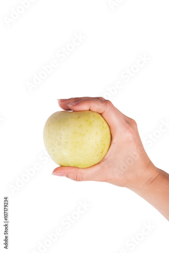 Summer green apple in hand isolated on white background
