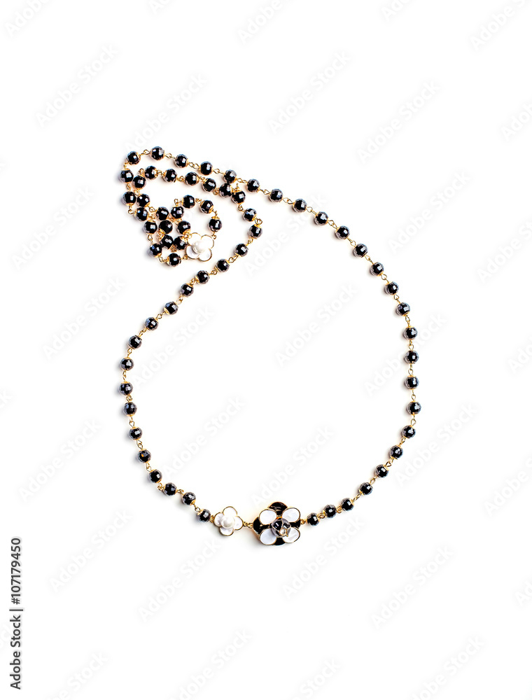 necklace with flower and black beads isolated necklace with flower and black beads isolated