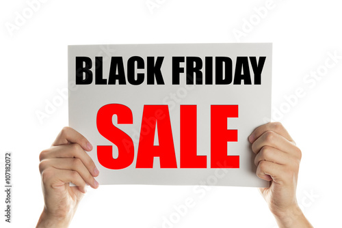 Hand holding a banner with the words black friday sale