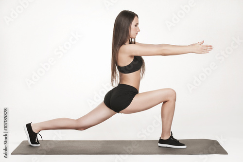 Woman exercising on man