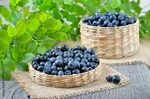 Wallpaper Mural Ripe  blueberries in basket on wooden table Torontodigital.ca