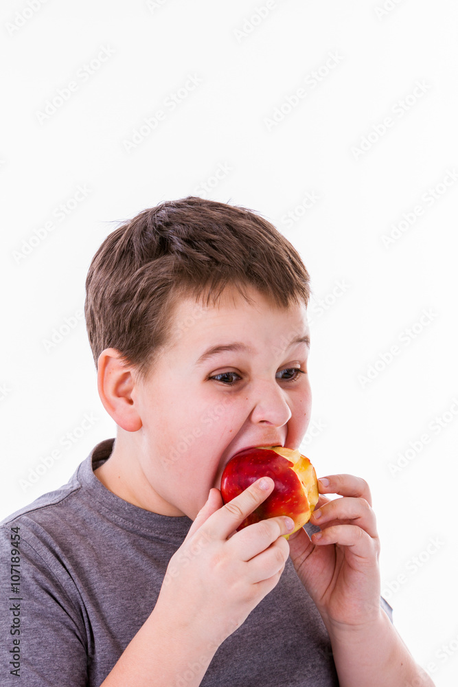 little boy with food isolated on white background - apple or a m little boy with food isolated on white background - apple or a m