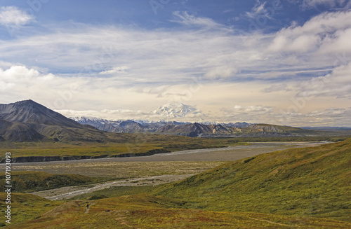Denali Peaking out of the Clouds across the Tundra