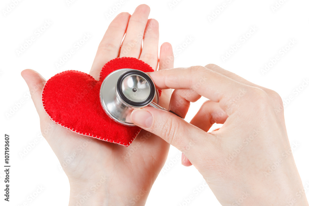 Fototapeta premium Red heart and a stethoscope on white background