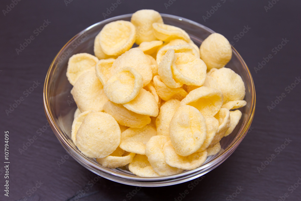 Snack on potato bowl on slate top