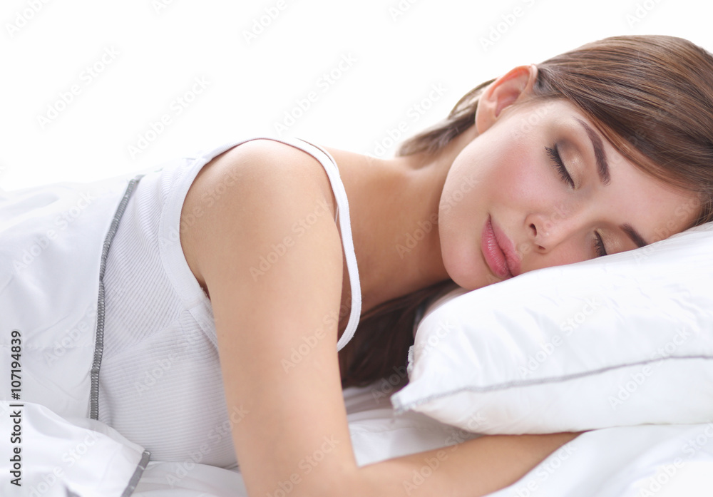 Beautiful girl sleeps in the bedroom, lying on bed Beautiful girl sleeps in the bedroom, lying on bed