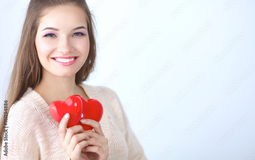 Portrait of beautiful happy woman holding a symbol heart. Portrait of beautiful happy woman holding a symbol heart.