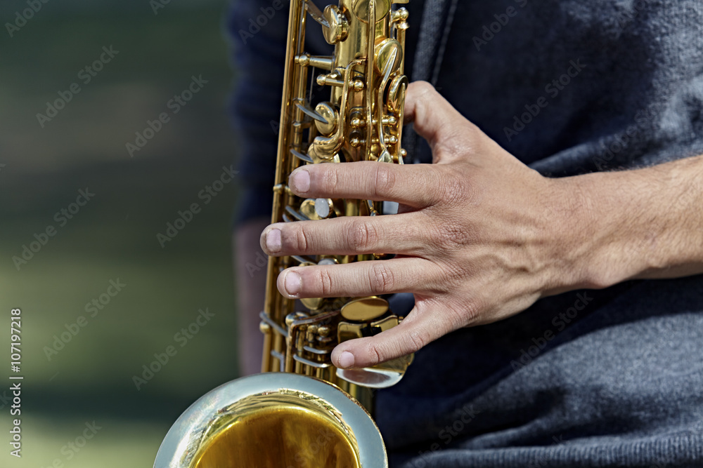 Fototapeta premium Young Man playing a Saxophone