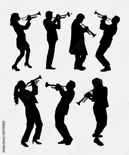 Trumpet instrument music player silhouette. Good use for symbol, logo, web icon, mascot, sticer, or any design you want. photo