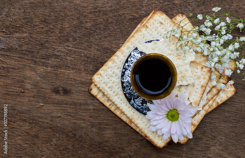 Pesach Still-life with wine and matzoh jewish passover bread photo