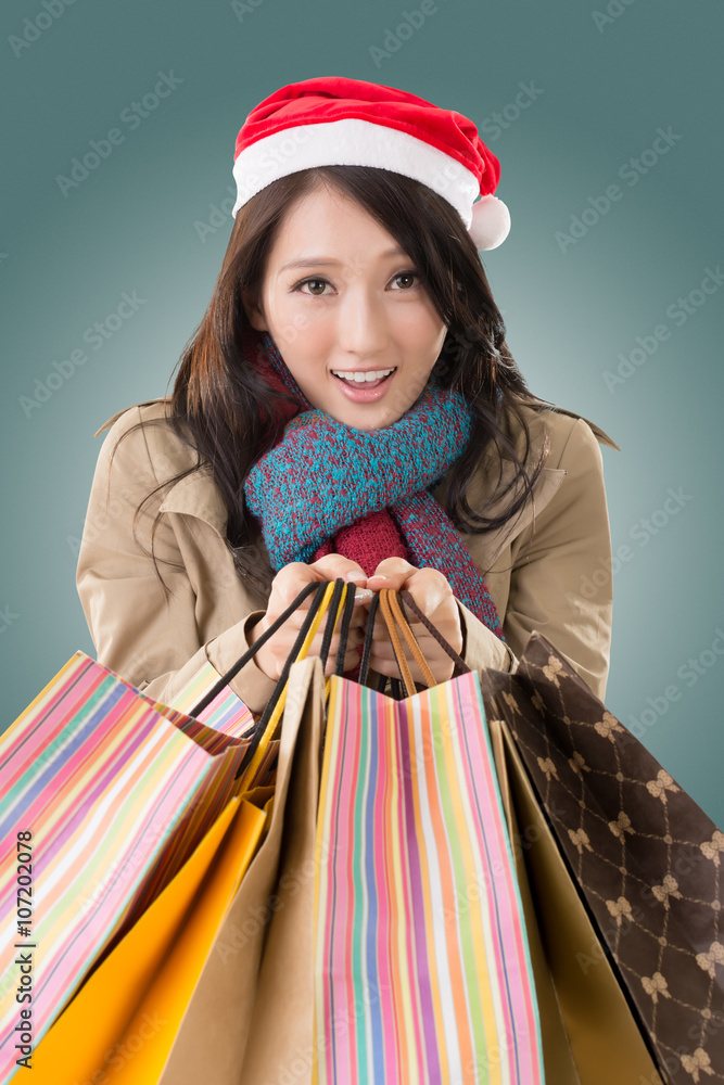 Happy shopping girl holding bags