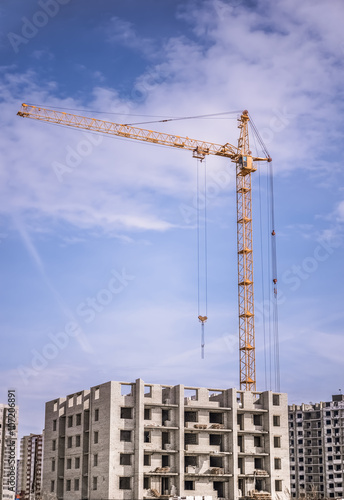 Construction site with crane and building