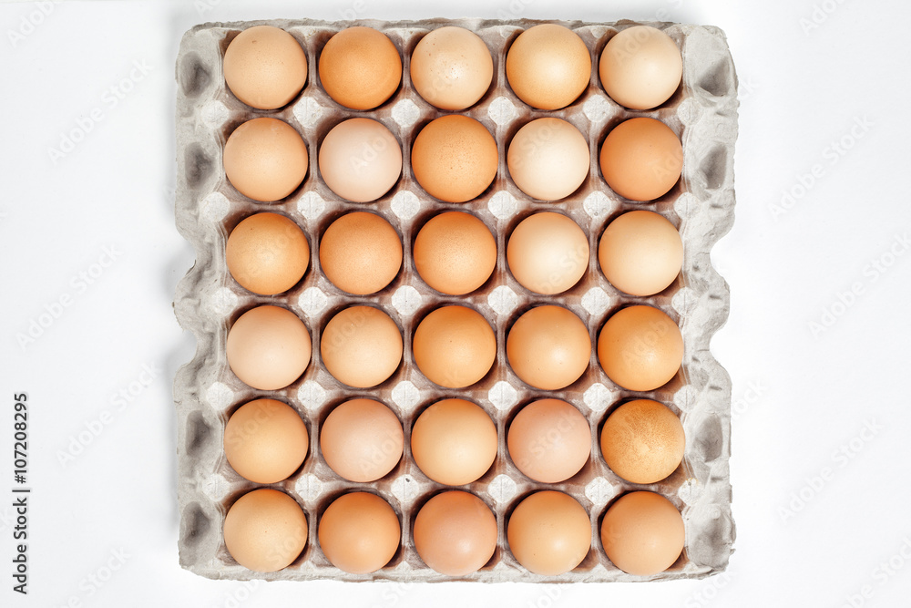 carton of fresh brown eggs