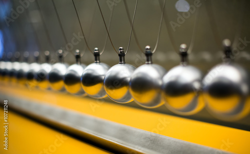 Row of metallic balls for inertia experiments photo