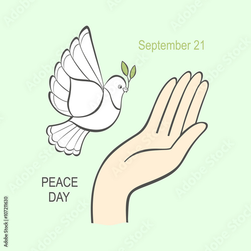 White dove with an olive branch and the human hand.