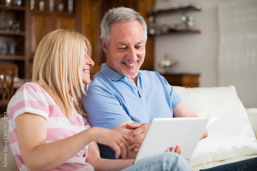 Mature couple using a digital tablet