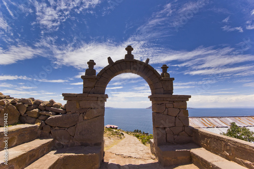 arch above titicaca lake in peru photo