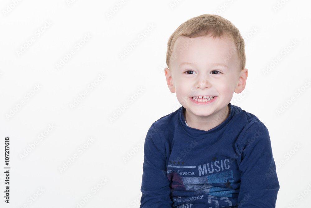 Three years old boy isolated and copy space on the right Three years old boy isolated and copy space on the right