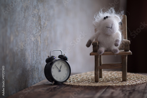 Sheep on a Chair and an alarm clock