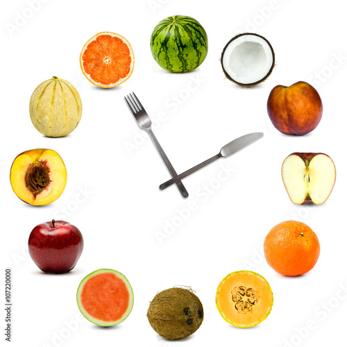 clock made of different fruit composition set isolated on white