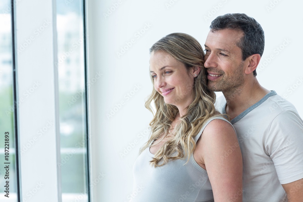 Couple looking away and smiling Couple looking away and smiling