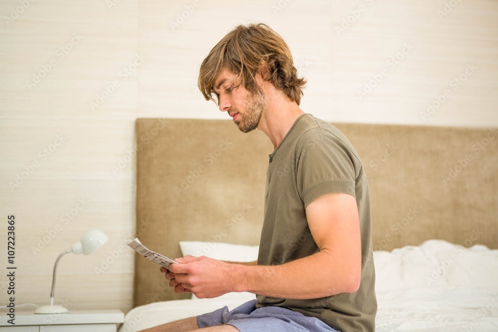 Handsome man reading a newspaper Handsome man reading a newspaper
