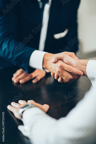 Handshake confirming business deal photo