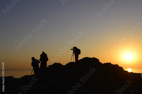In the seaside, the silhouette of the photographer