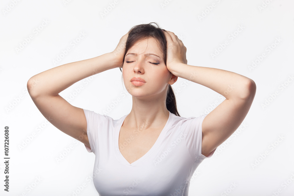 Headache concept - young woman suffering a migraine Headache concept - young woman suffering a migraine
