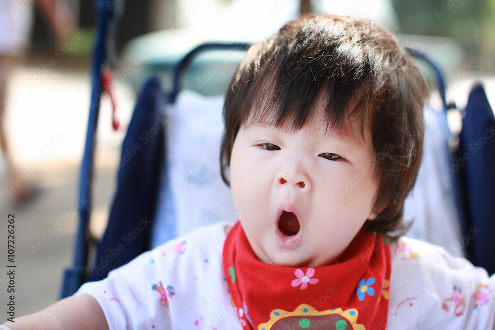 Happy baby girl in Stroller
