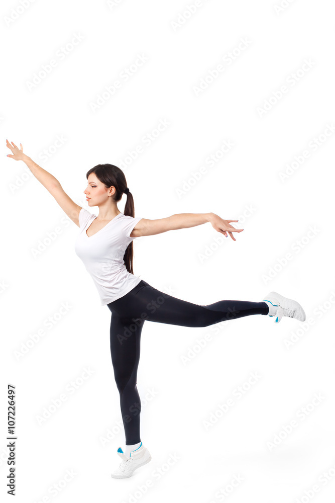 Pretty modern woman jumping dancing isolated on a white studio background Pretty modern woman jumping dancing isolated on a white studio background