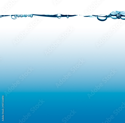 фотографія waterline with splash and bubbles with blue and white background