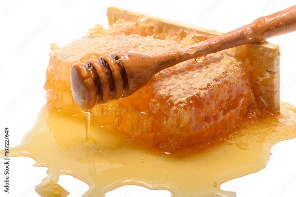 Fresh honey with honeycomb taken on white background Fresh honey with honeycomb taken on white background