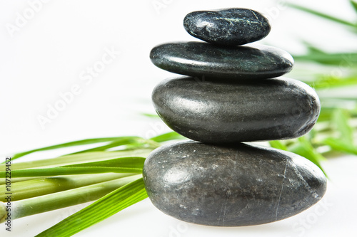 spa la stone health therapy pebbles stack isolated on white with bamboo