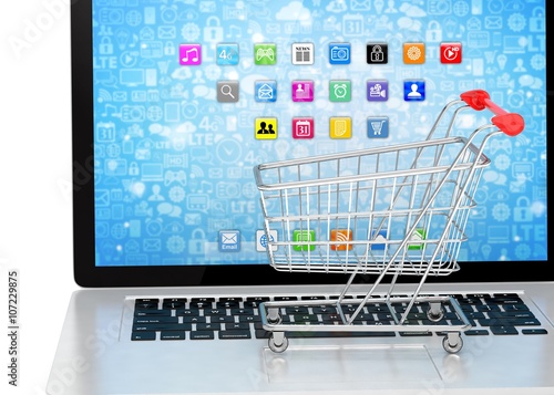 Shopping cart on laptop. 3d rendering.