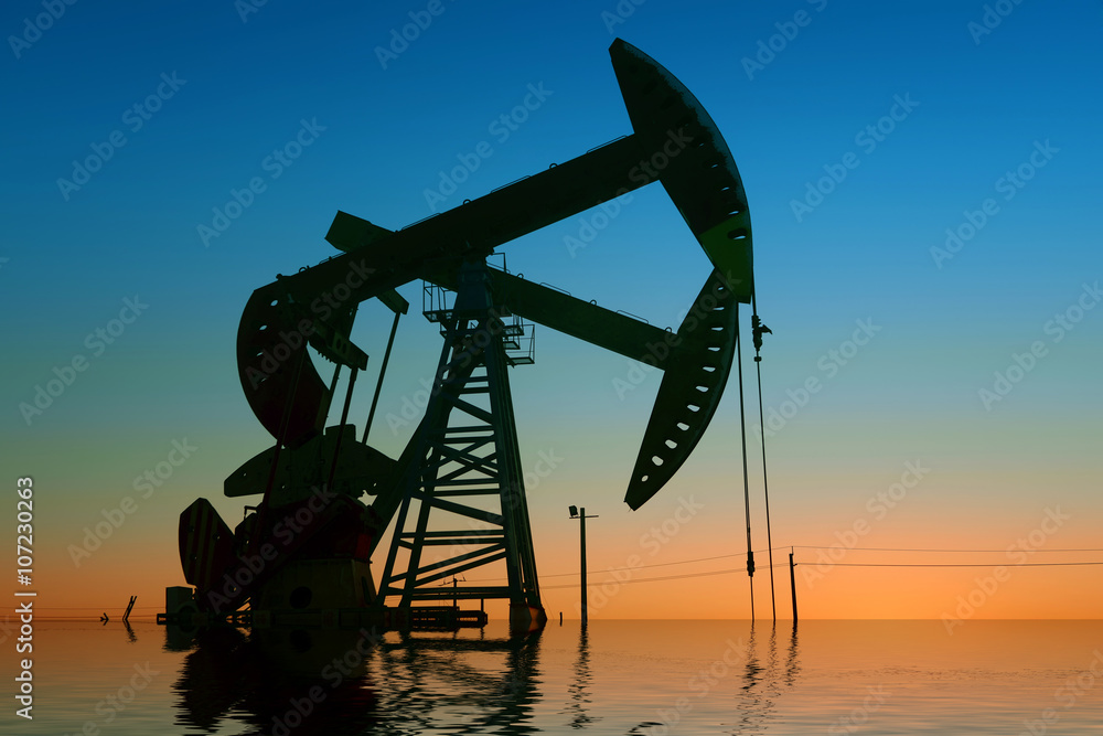 The beam pumping unit is homework, sunset in oil field The beam pumping unit is homework, sunset in oil field